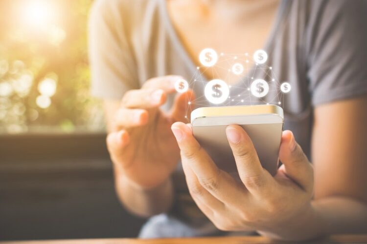Woman hand using mobile phone with online transaction application, Concept e-commerce and internet investment